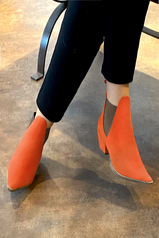 French elegance and refinement for these clementine orange and taupe brown dress booties, with elastics on the sides, 
                available in many subtle leather and colour combinations. This pretty bootie will do you a lot of good throughout the seasons.
Easy to put on with its elastic bands, it has everything to seduce you.
For the fans of very sharp models like "santiag..." 
Personalize it or not, with your colours on the page "My favorites".  
                Matching clutches for parties, ceremonies and weddings.   
                You can customize these ankle boots with elastics to perfectly match your tastes or needs, and have a unique model.  
                Choice of leathers, colours, knots and heels. 
                Wide range of materials and shades carefully chosen.  
                Rich collection of flat, low, mid and high heels.  
                Small and large shoe sizes - Florence KOOIJMAN